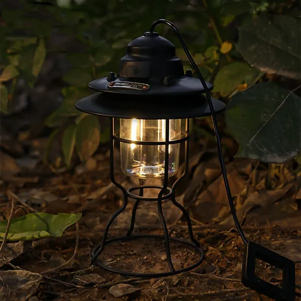 Lantern lit on the ground at night