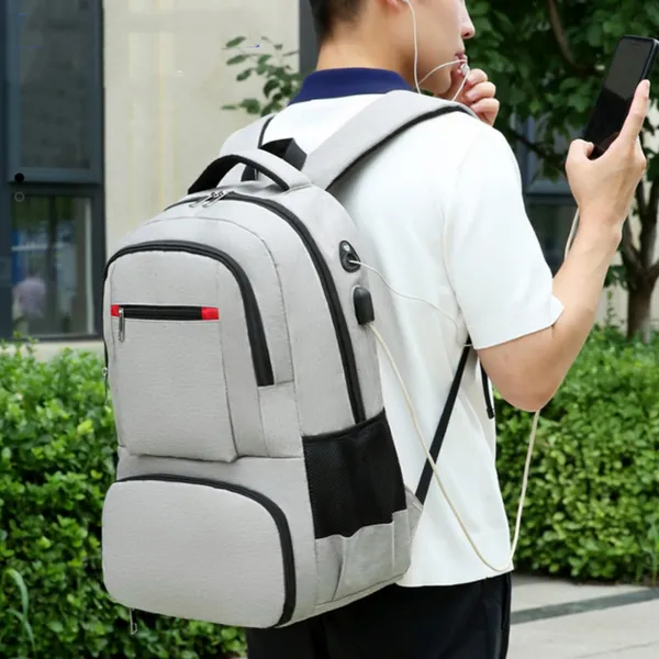 Grey backpack worn, mesh side pocket